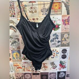 Lrg La vie en Rose bathing suit. Black cross over one piece design. Built in bra